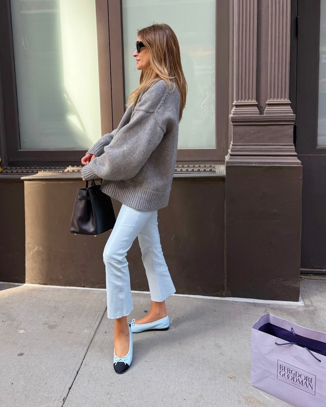 Woman wearing a Chanel ballet flats outfit.