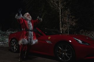 Timothy Spall as Santa with a sporty red car!