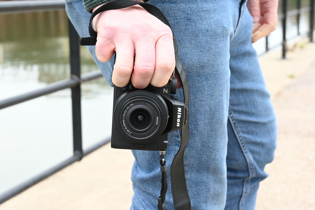 Man holding Nikon Z50 II 