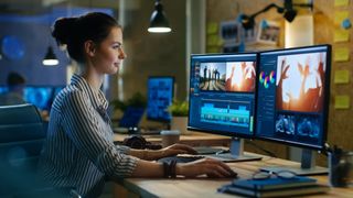 Woman editing video with a PC