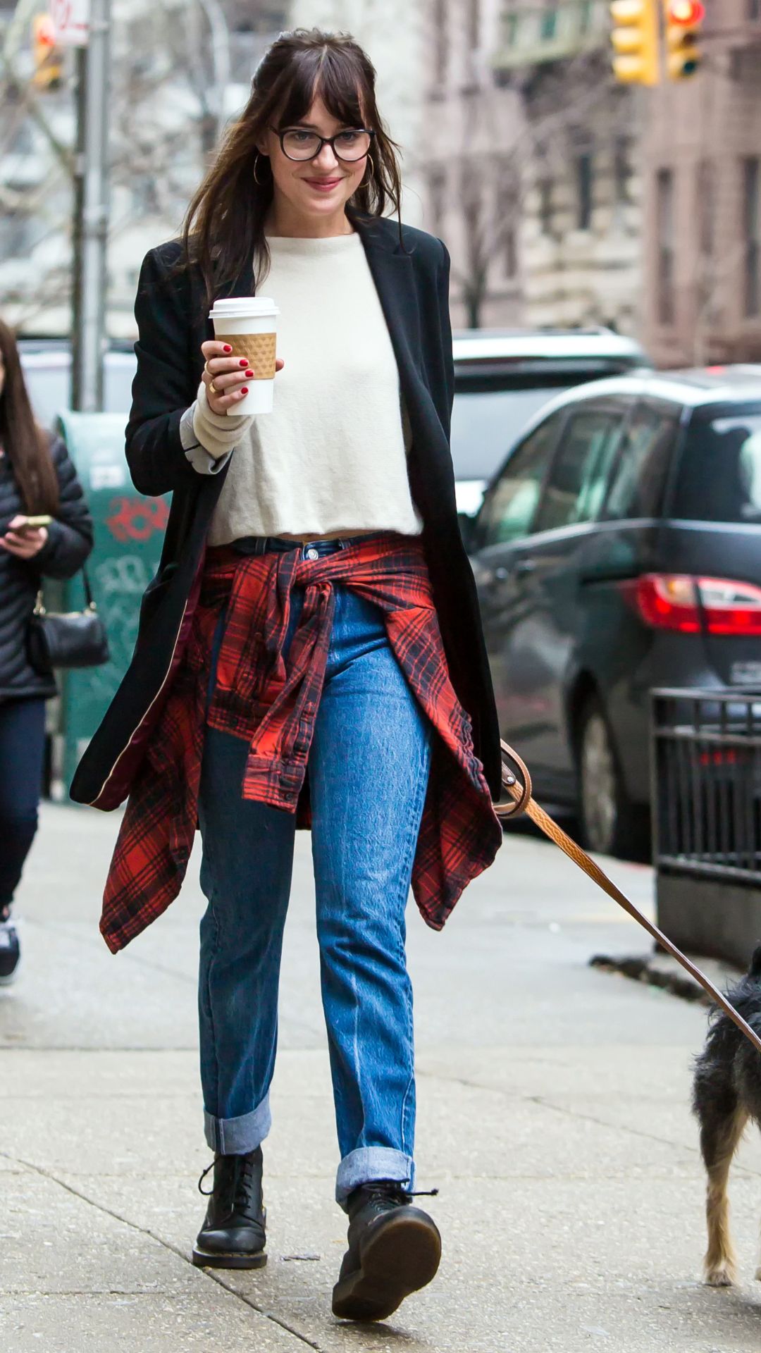 Dakota Johnson wearing Dr Martens with jeans and black blazer in April, 2015