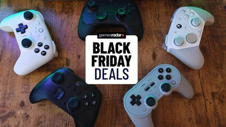 A collection of controllers from 2025 scattered around a desktop, with a Black Friday deals stamp in the middle of them
