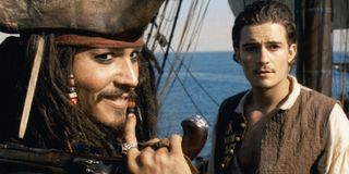 Johnny Depp and Orlando Bloom in Pirates of the Caribbean: The Curse of the Black Pearl