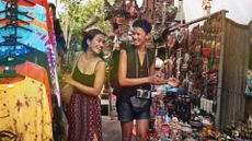 Travel money shopping two woman happy on a holiday