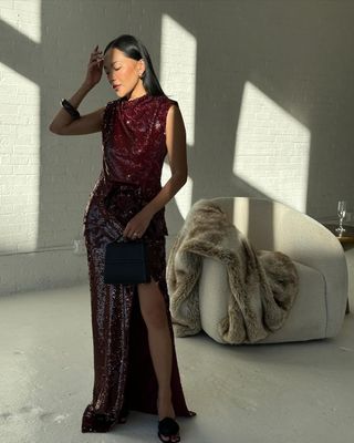 @dawn.tan wearing a burgundy sparkle dress