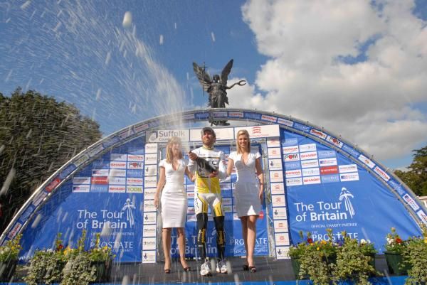 Race leader Michael Albasini (Team HTC - Columbia) on the podium with more champagne.