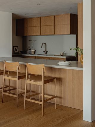 A kitchen with concrete walls