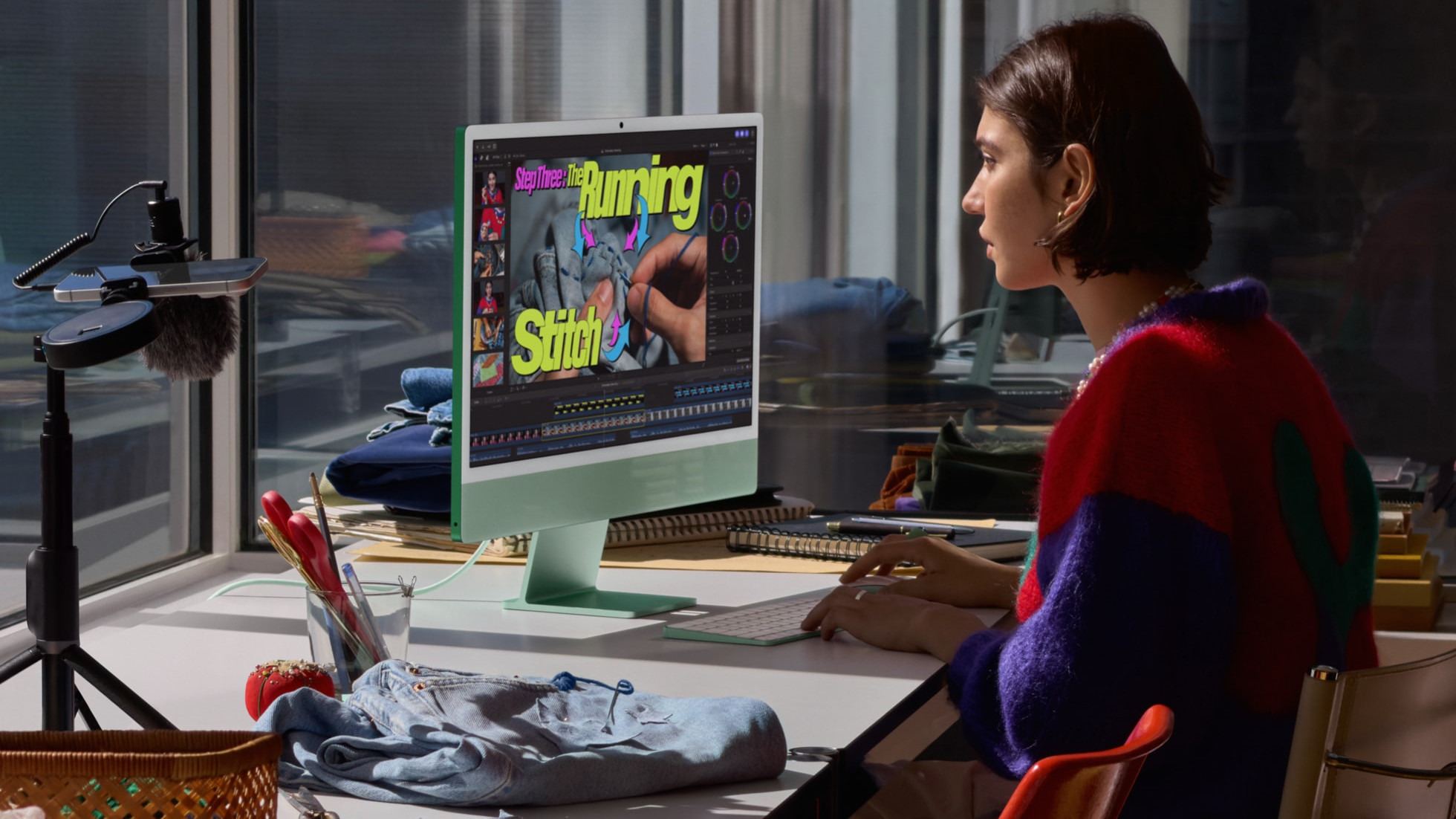 Apple iMac M6 being used by a person sat at a desk