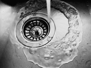 rinsing off a stainless steel sink