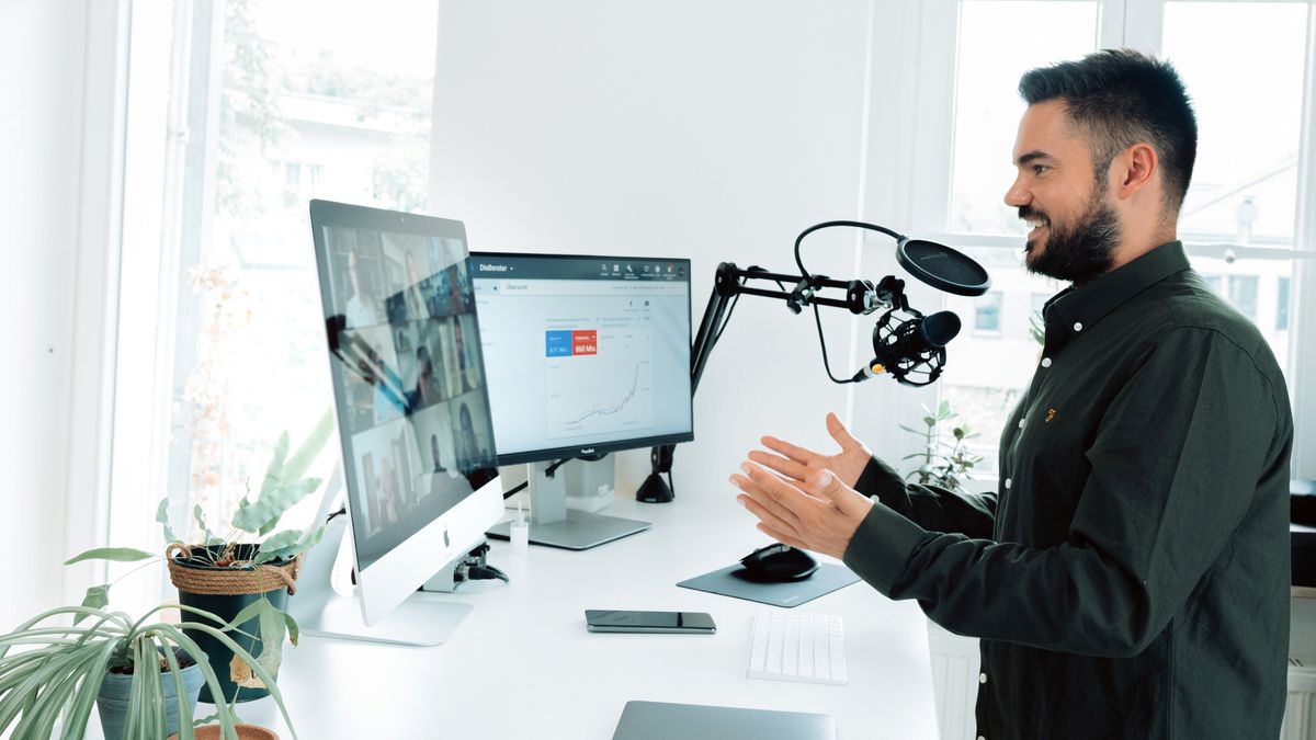 Man Video Conferencing at a Standing Desk