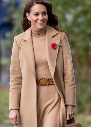 Kate Middleton wearing a camel coat.