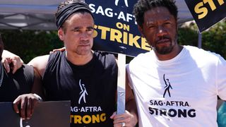 Actors Colin Farrell and Tory Kittles demonstrate on the picket line