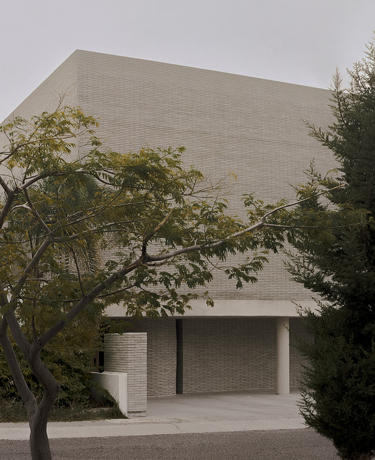 Mexican house designed as a refuge, tall walls, blind from street, plants and minimalist serenity inside