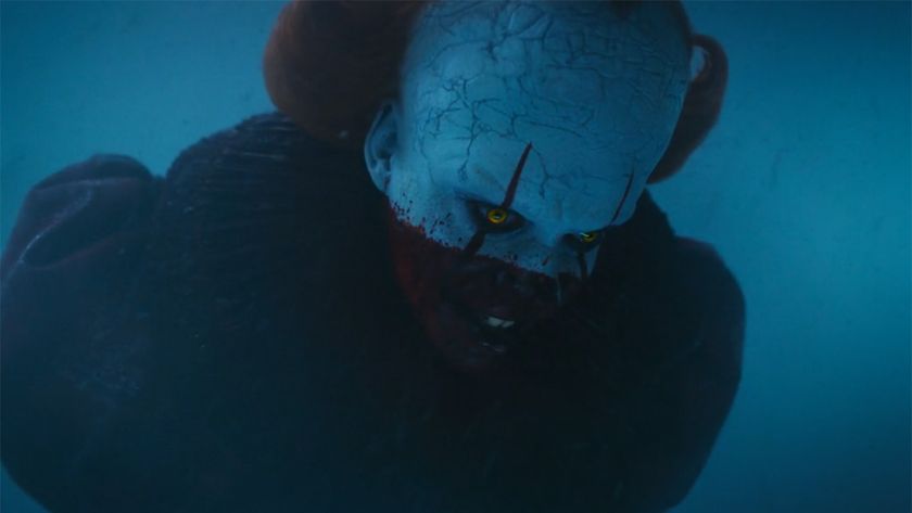 Pennywise face half covered in blood looking down in IT: Welcome To Derry