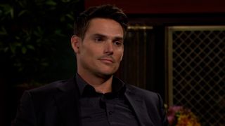 Mark Grossman as Adam slightly smirking in The Young and the Restless