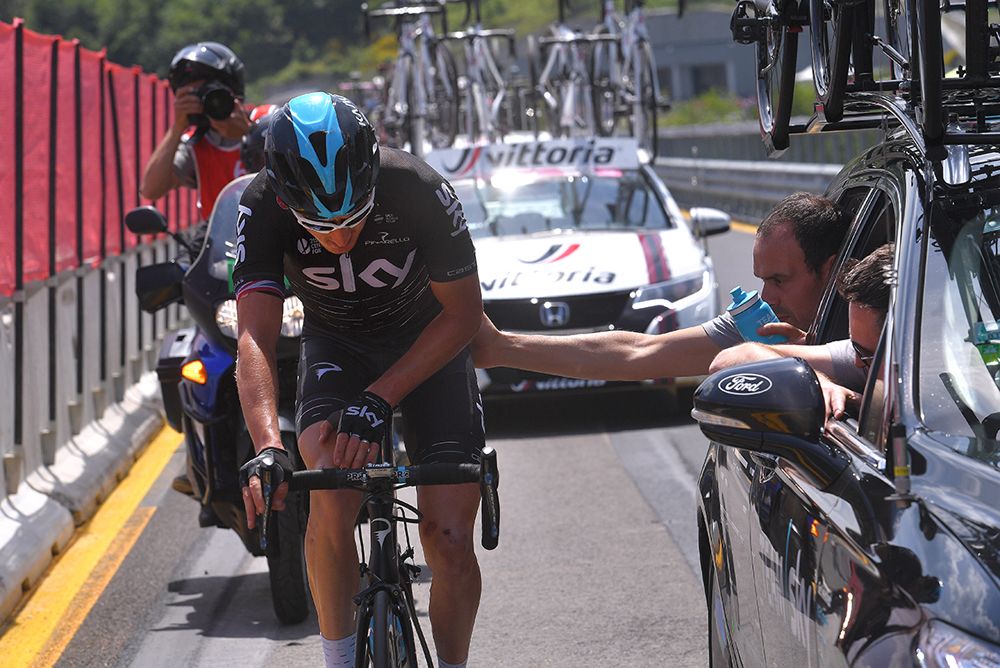 Geraint Thomas (Team Sky) drops back to the team car