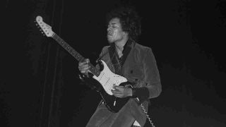 Jimi Hendrix performing onstage at London’s Saville Theatre in 1967