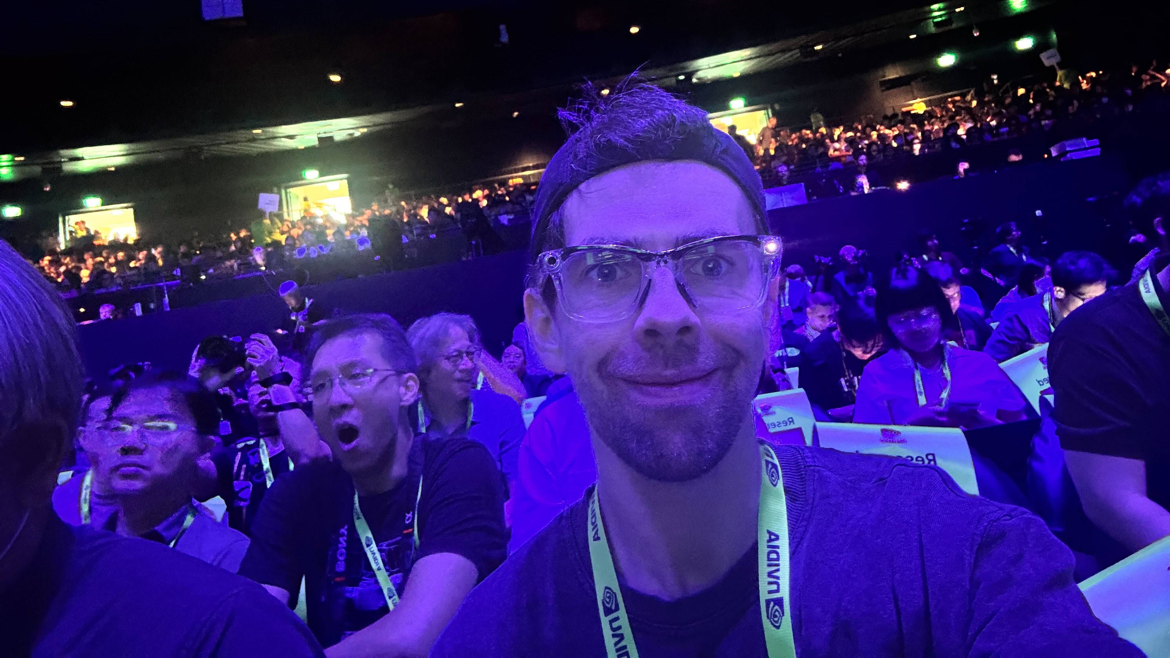 Person smiling in showfloor crowd at Nvidia Computex 2025 keynote