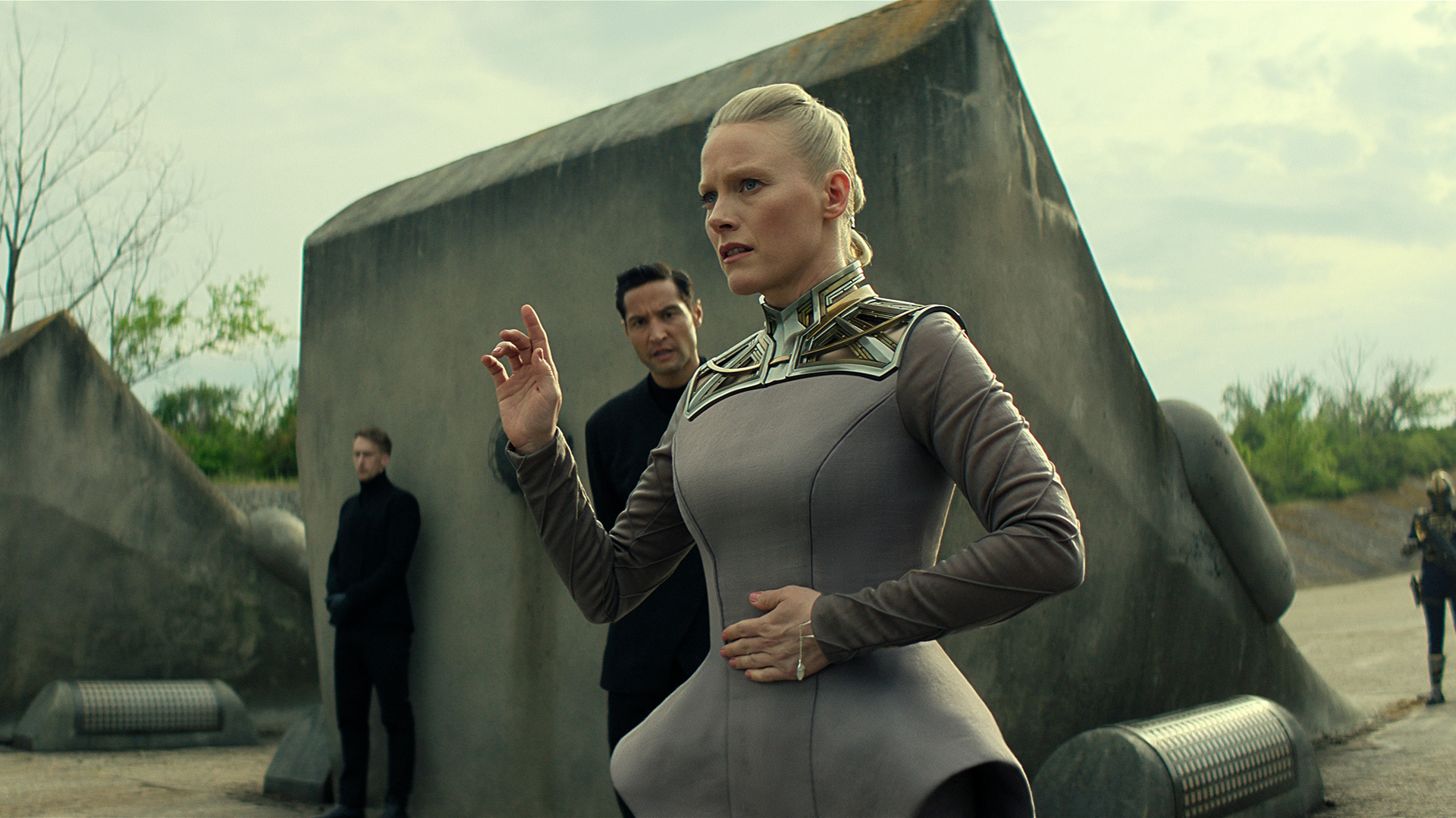 Demerzel raising her right hand to silence someone in Foundation season 3 episode 5