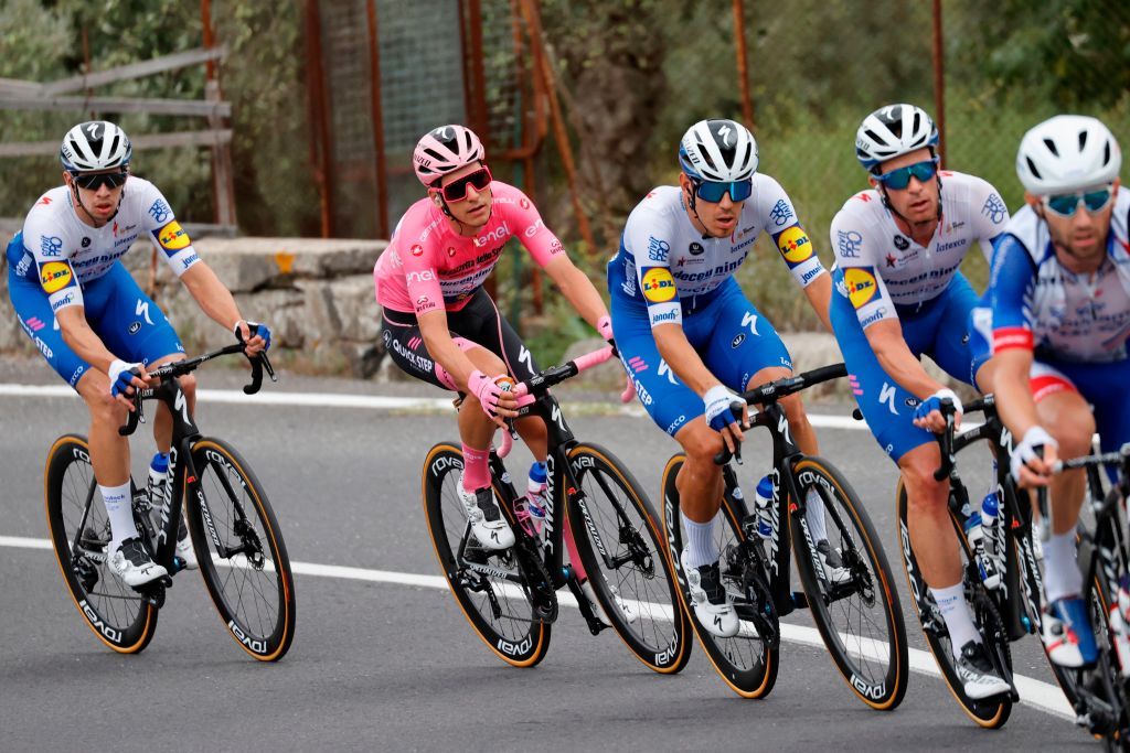 Team Deceuninck rider Portugals Joao Almeida 2ndL wearing the overall leaders pink jersey rides during the 4th stage of the Giro dItalia 2020 cycling race a 140kilometer route between Catania and Villafranca Tirrena Sicily on October 6 2020 Photo by Luca Bettini AFP Photo by LUCA BETTINIAFP via Getty Images