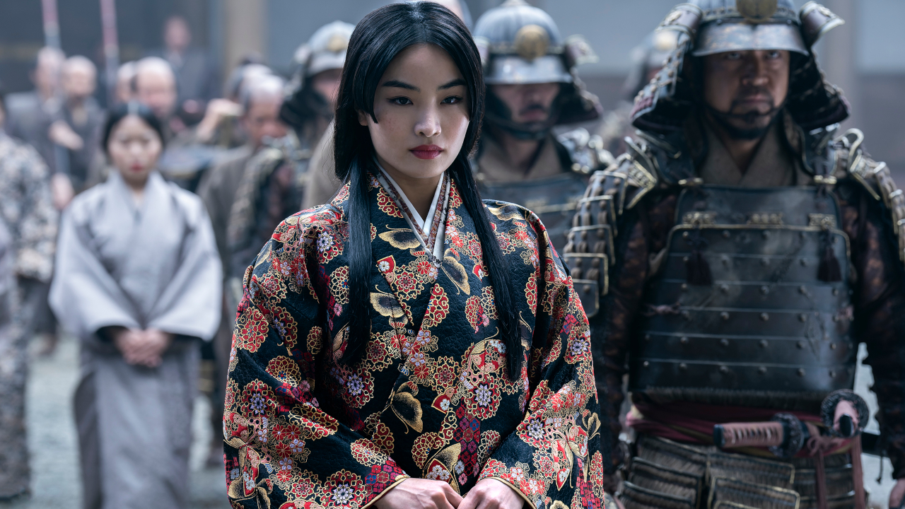 Anna Sawai defiantly stands next to Shogun's armored guard.