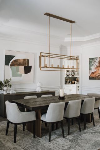 formal dining table with white chairs rectangular light and modern art