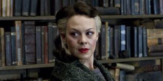 Helen McCrory as Narcissa Malfoy, standing in a study, in Harry Potter.