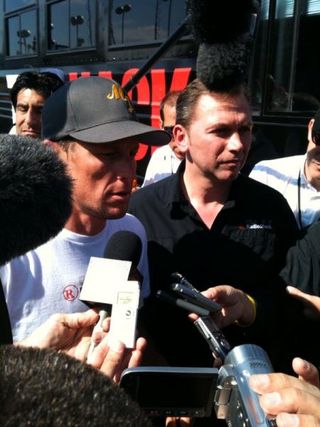 Lance Armstrong and Johan Bruyneel face the press