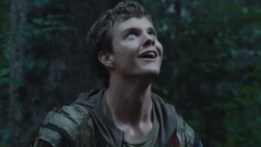 Jack Quaid as Marvel looking up in The Hunger Games