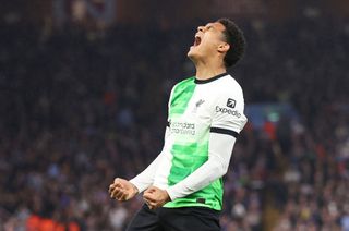 Jarell Quansah of Liverpool celebrates scoring his team's third goal during the Premier League match between Aston Villa and Liverpool FC at Villa Park on May 13, 2024 in Birmingham, England.