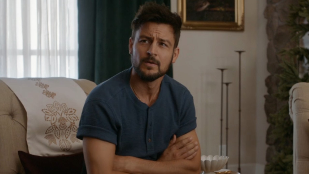 Tyler Hynes crossing his arms in Three Wise Men and a Baby.