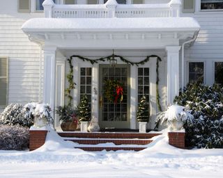 Christmas front door with wreath and garland