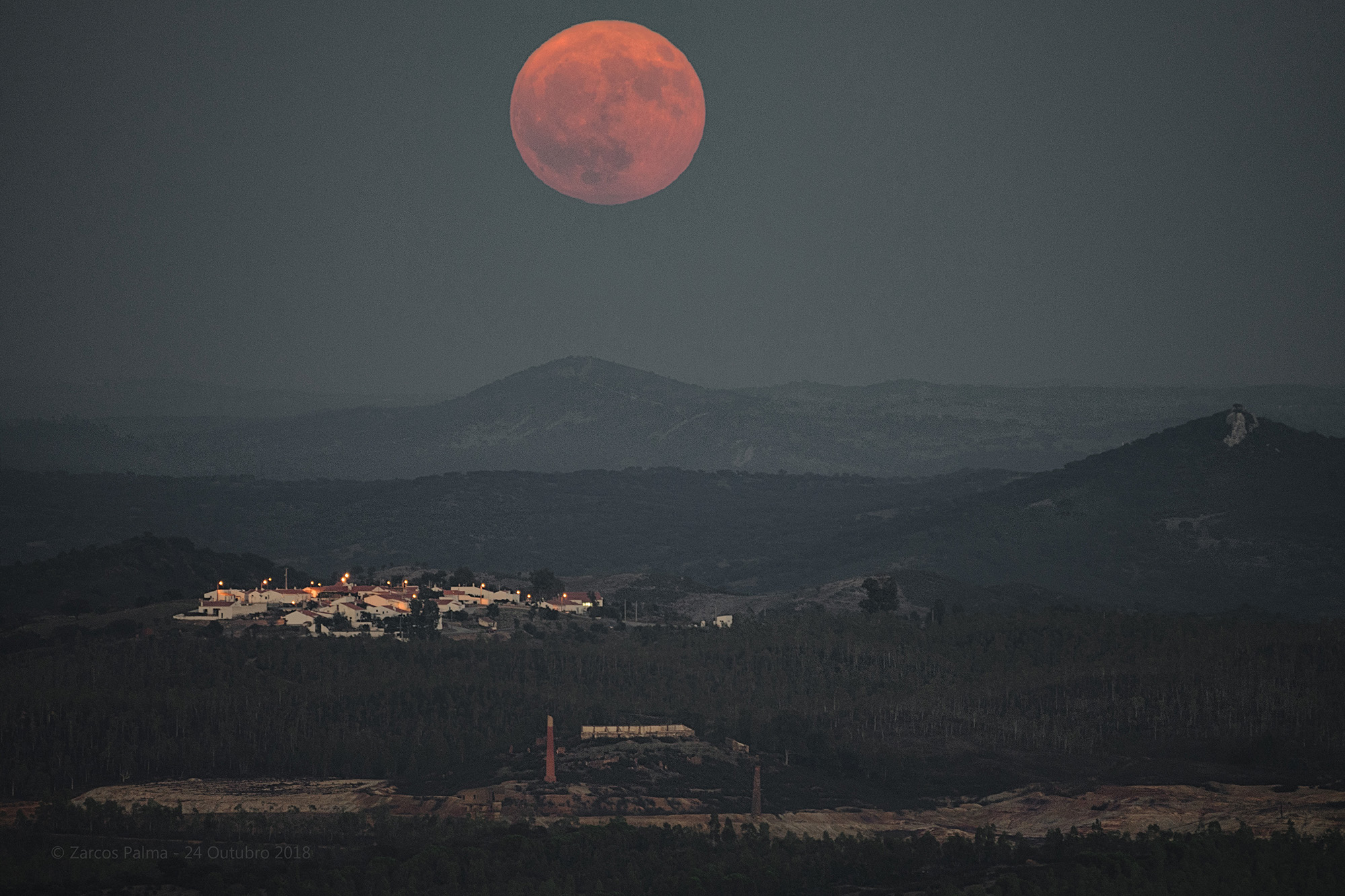 The full moon of October, sometimes referred to as the Hunter's Moon, rises over the small Portuguese village of Montes Altos in this photo by José Zarcos Palma.  He captured this photo from a hilltop in the nearby town of Moreanes on Oct.  24, 2018.