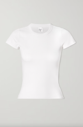 a white t shirt in front of a plain backdrop