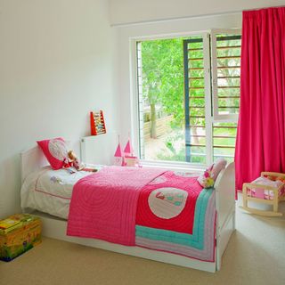 childrens room with pink curtain white wall