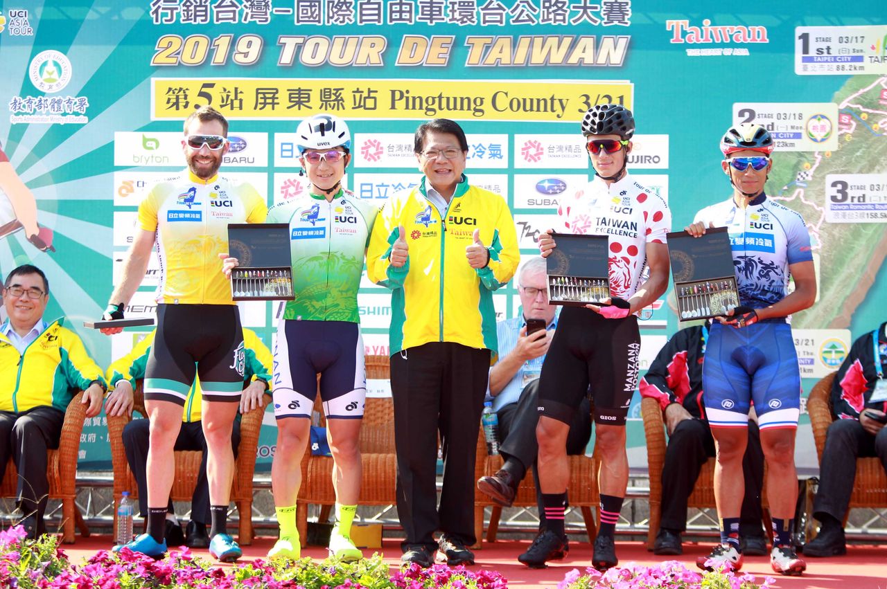 Floyd's Pro Cycling's Jonny Clarke in yellow on the Tour de Taiwan podium