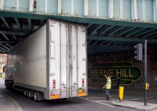 A high-sided HGV lorry squeezes under the railway bridge over the A215 at Herne Hill. Credit: Richard Baker / In Pictures via Getty Images