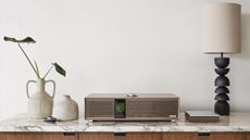 The Ruark Audio R-CD100 CD player next to another 100 Series device