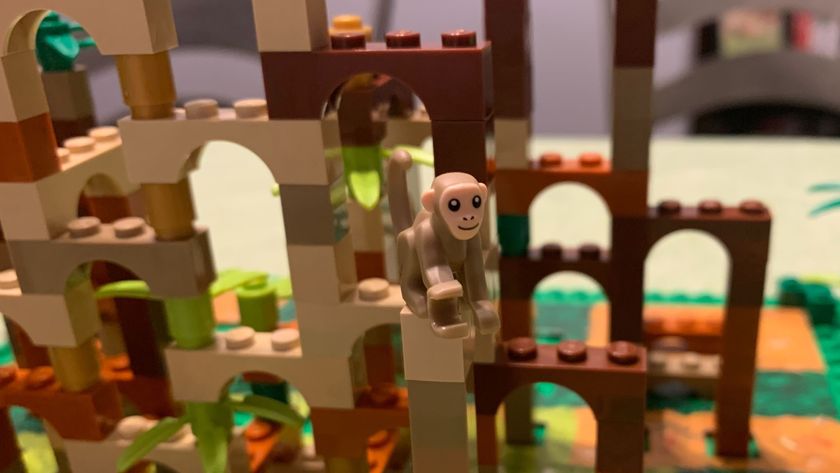 Lego arches built atop one another, with a monkey minifigure in the foreground