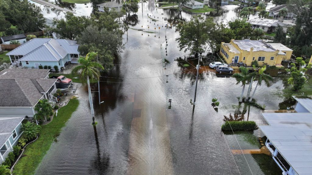 In this aerial view, flood waters inundate a neighborhood after Hurricane Milton came ashore on October 10, 2024, in Punta Gorda, Florida. 