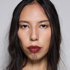 Model wearing a bold lip backstage