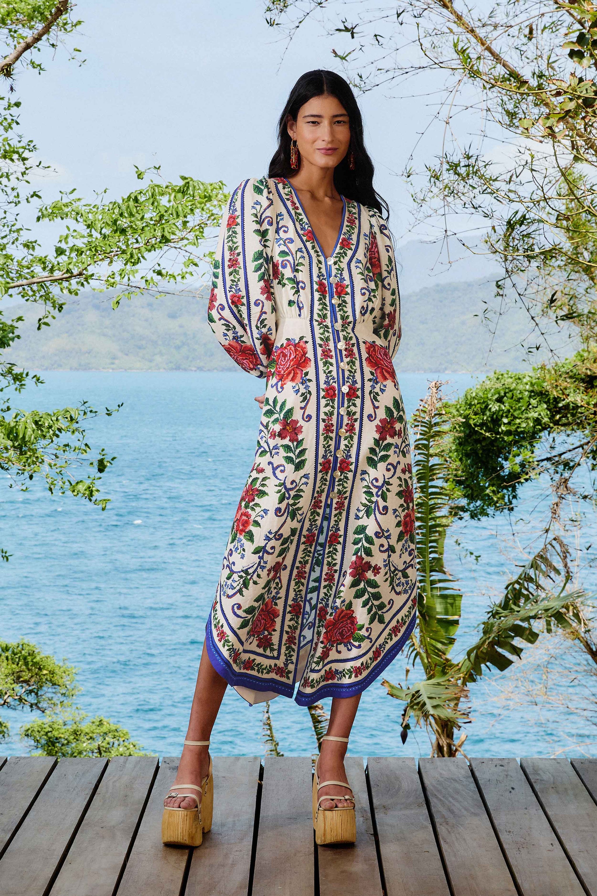 a model wearing a patterned farm rio dress