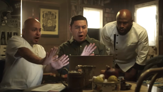 Julio, Luis and Chef Percy reacting to something on laptop in This Fool