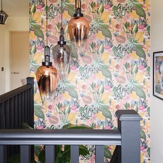 Hallway with black staircase and wallpaper