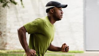 Male runner wearing t-shirt and cap