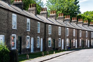 stone terrace houses with sash windows and white doors