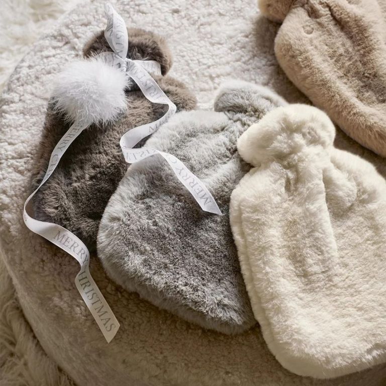The White Company’s Super-Soft Faux Fur Hot Water Bottles all together