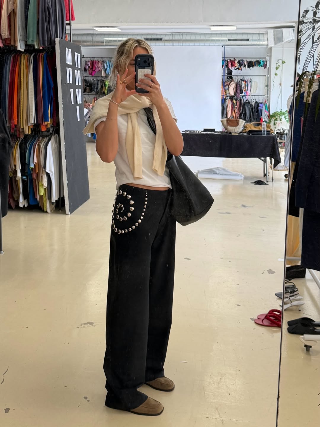 @lucywilliams02 wears white tee and black studded jeans