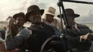 Delta Slim (Delroy Lindo), Stack (Michael B. Jordan), Sammie (Miles Caton) and Cornbread (Omar Benson Miller) drive along the road in Sinners