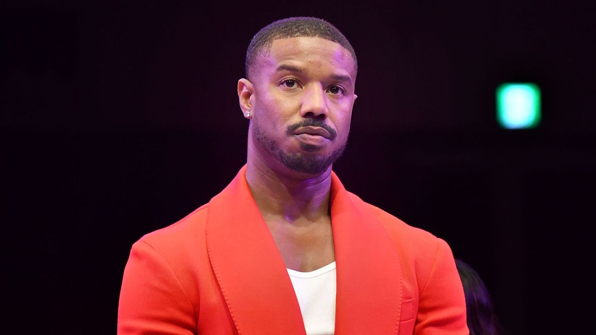 &quot;I Am Legend 2&quot; star Michael B. Jordan in a red blazer at the 2023 Japan Premiere of &quot;Creed III&quot;.